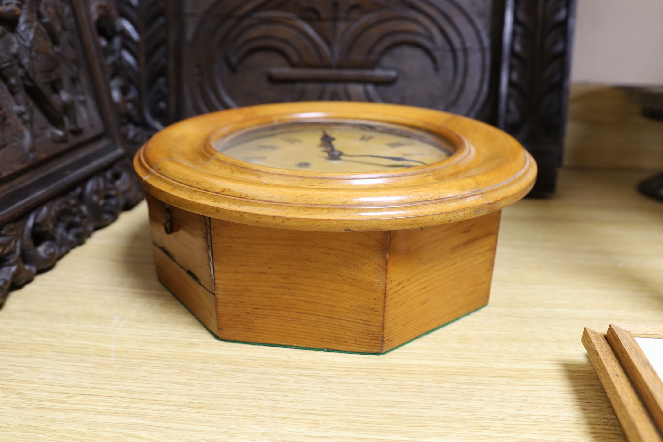 A Black Forest beech dial wall clock, 34cms diameter